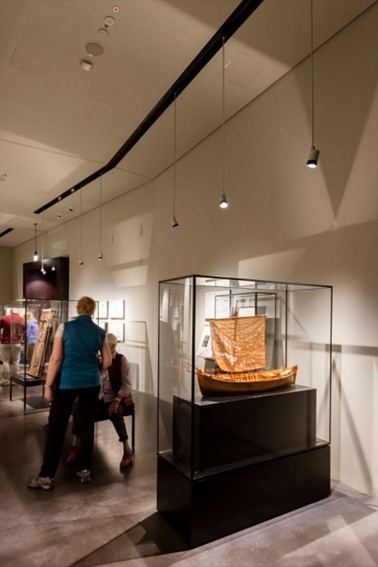 Mini track spotlights installed in a museum exhibition space.