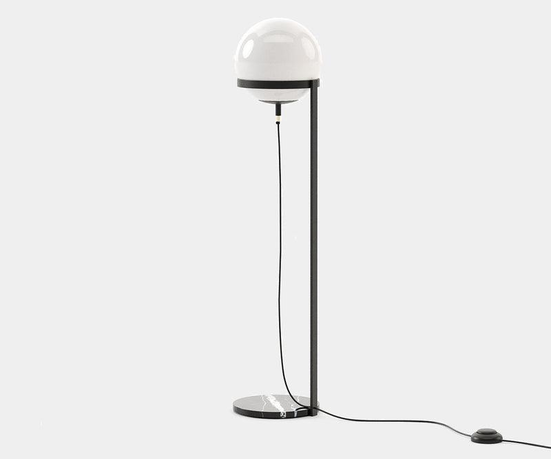 Front view of a globe floor lamp highlighting its elegant spherical diffuser and refined architectural proportions.