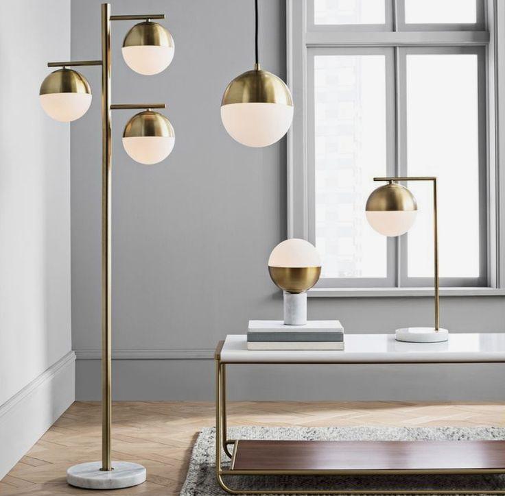 Collection of globe floor lamps featuring opal glass diffusers and premium decorative finishes for contemporary interiors.