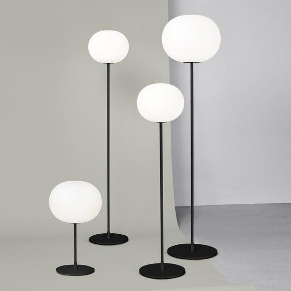 Collection of globe floor lamps featuring opal glass diffusers and premium decorative finishes for contemporary interiors.