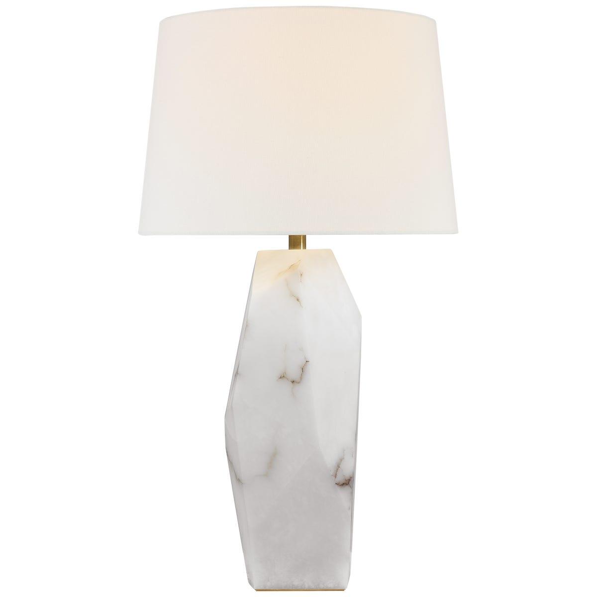 Marble table lamp photographed on a clean white background highlighting the natural stone base and premium finishes.