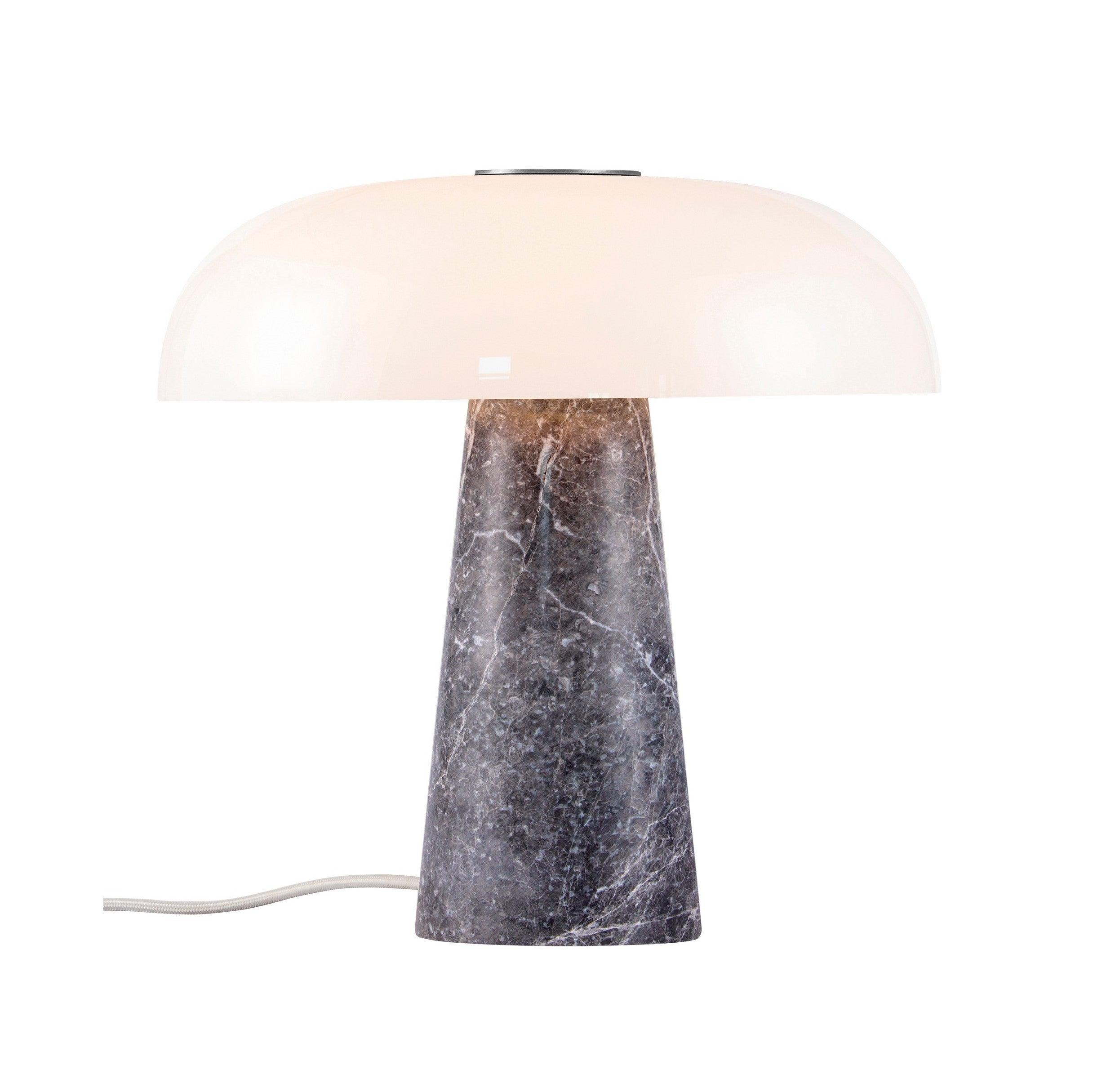 Marble table lamp photographed on a clean white background highlighting the natural stone base and premium finishes.