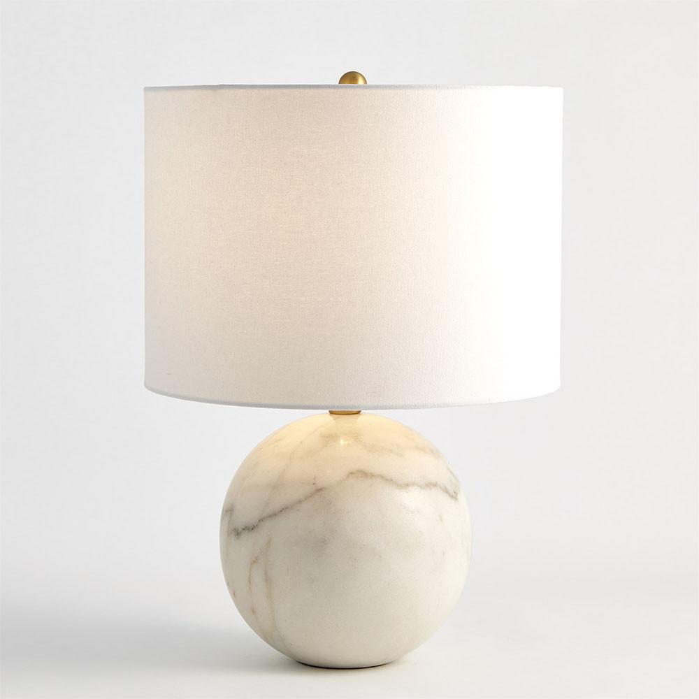 Front view of a marble table lamp showcasing elegant proportions, luxurious materials and refined detailing.
