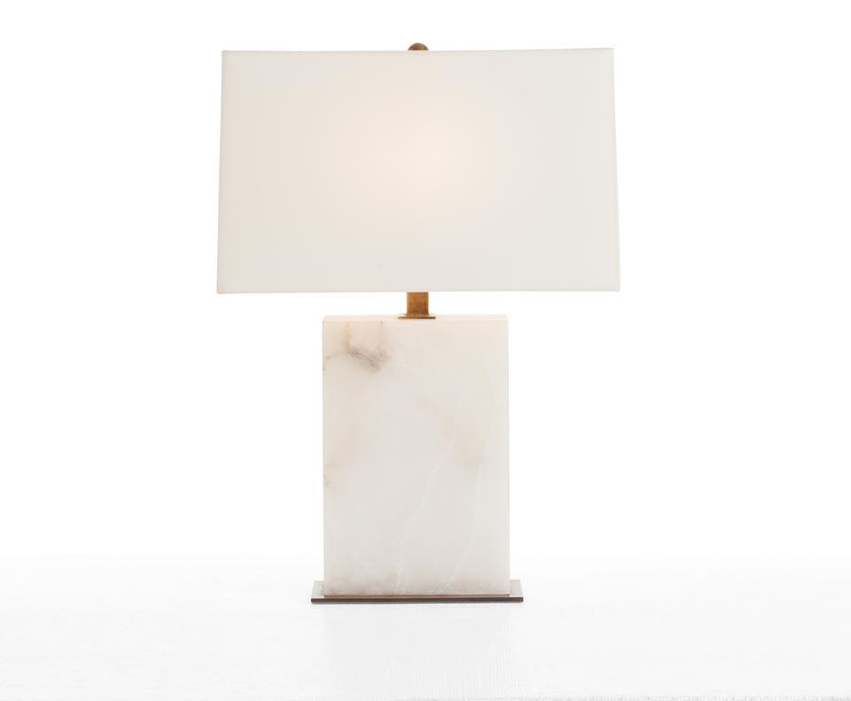 Marble table lamp photographed on a clean white background highlighting the natural stone base and premium finishes.