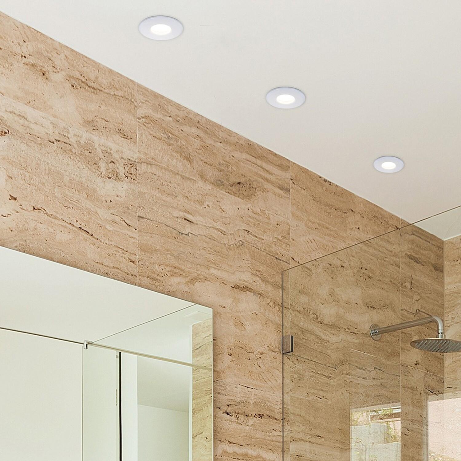 Waterproof recessed downlights installed in a spa and wellness ceiling application.