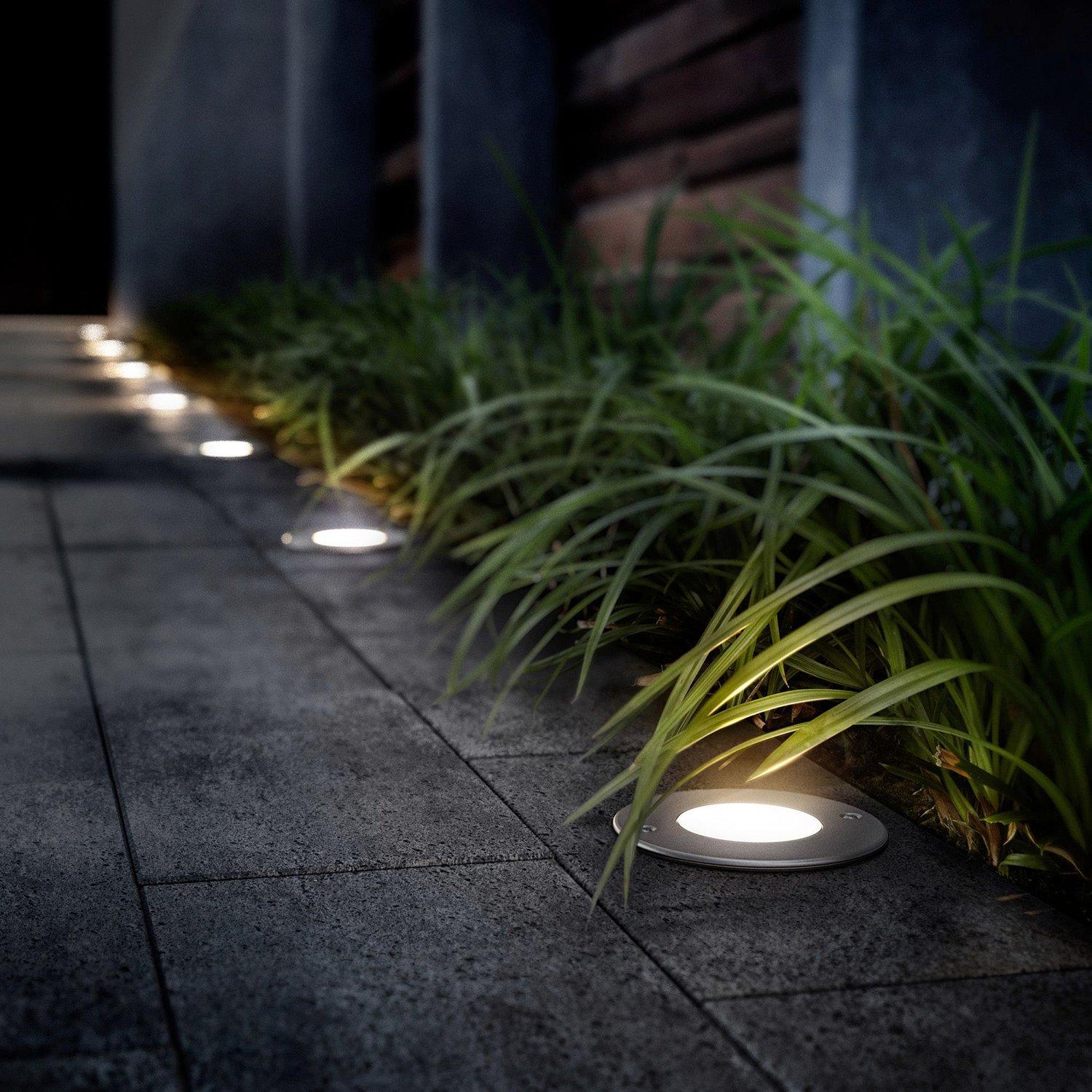 Mini inground lights installed in a contemporary landscape project.