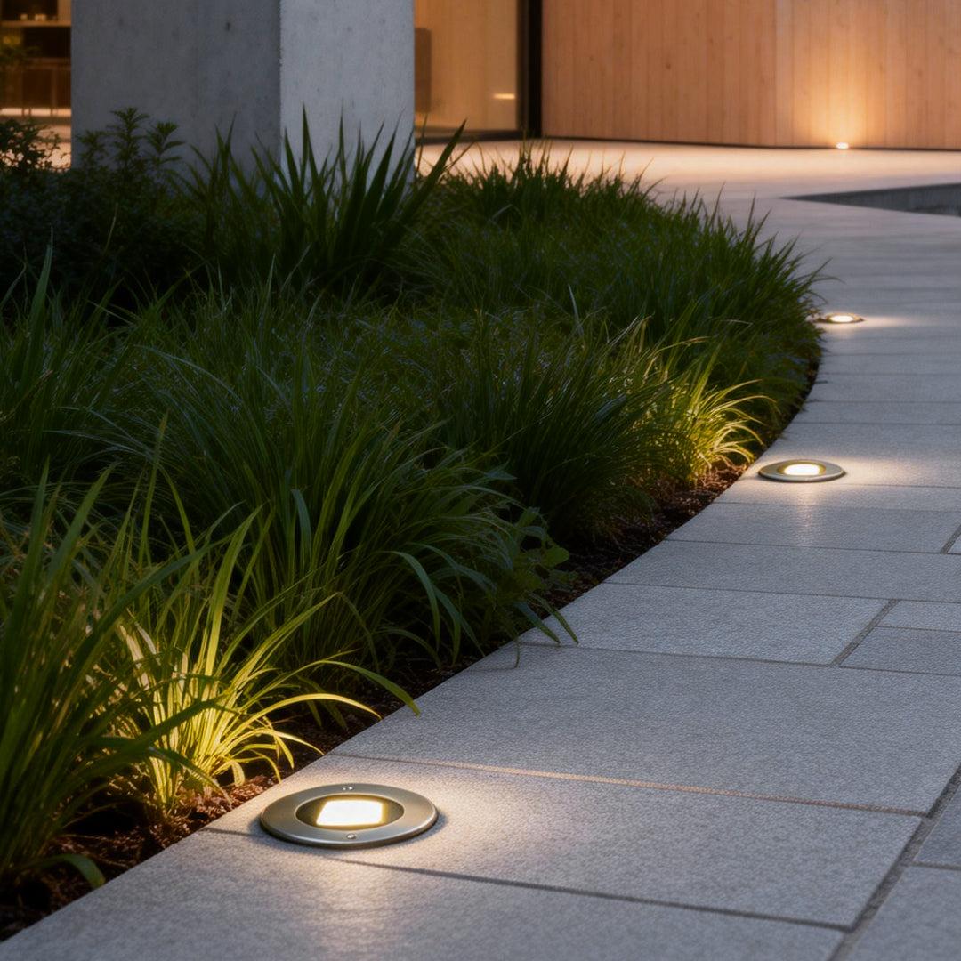 Mini inground lights installed in a contemporary landscape project.