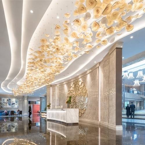 Luxury decorative ceiling light used in an elegant hotel lobby interior