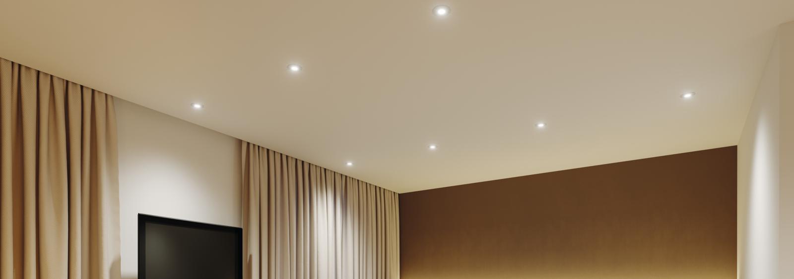 Low glare recessed downlight installed in a contemporary hospitality interior.