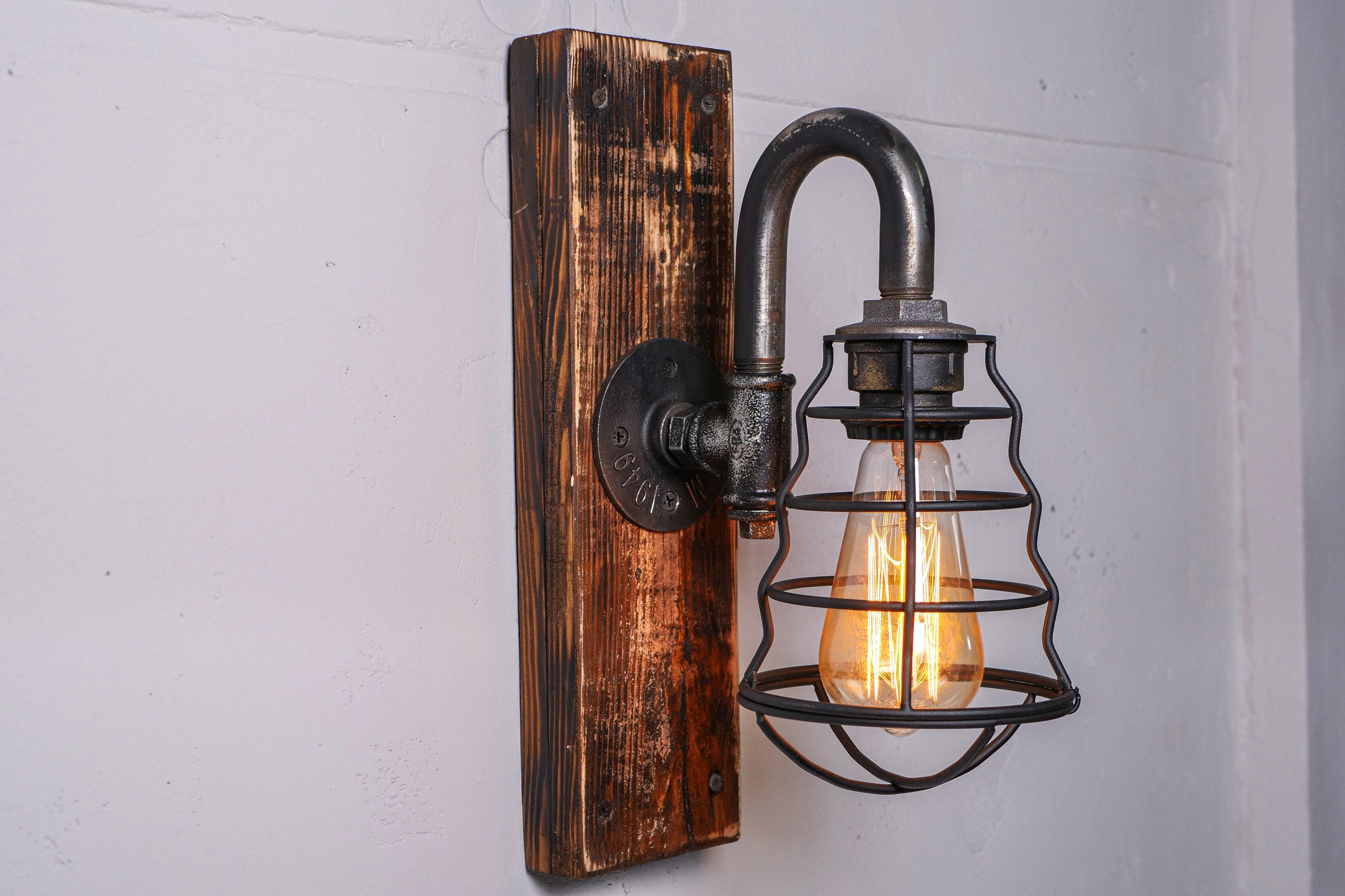 Front view of a handcrafted rustic wall lamp with natural materials.