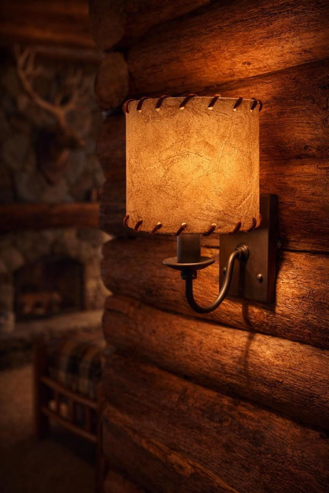 Rustic wall lamp installed in a luxury mountain lodge with warm architectural interiors.