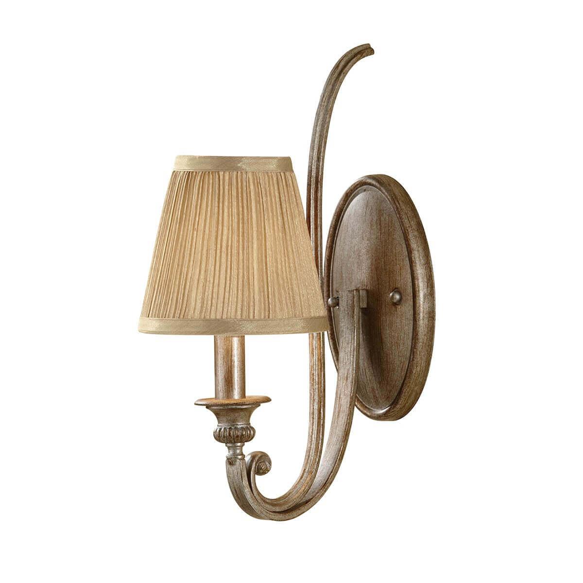 Rustic wall lamp featuring wood and wrought iron photographed on a clean white studio background.