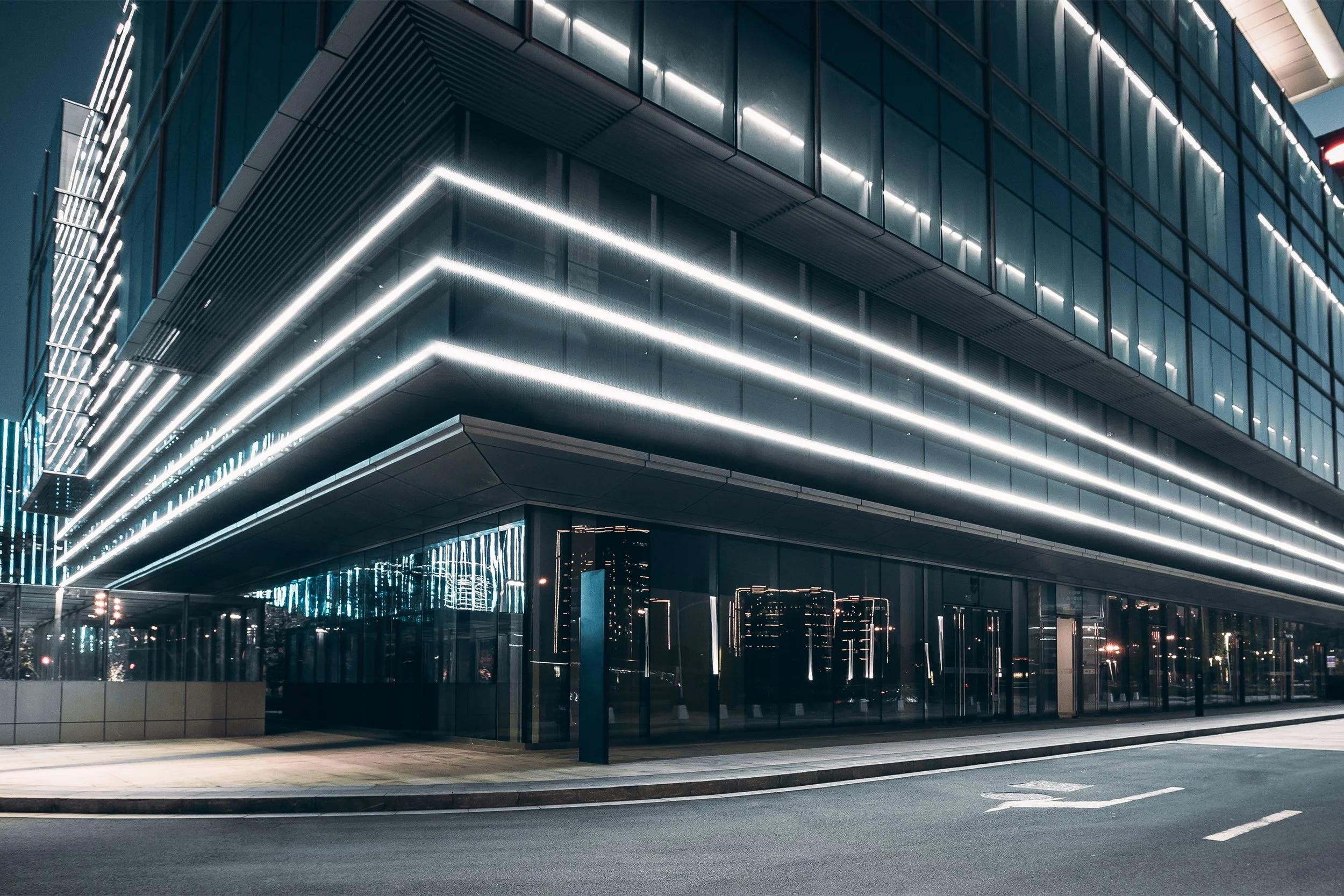 Linear facade lights highlighting a contemporary building façade.