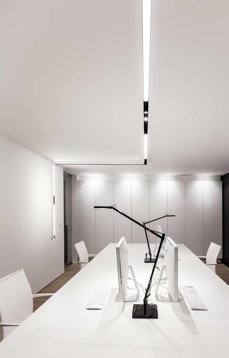 Magnetic diffused linear lights installed in a contemporary office environment.