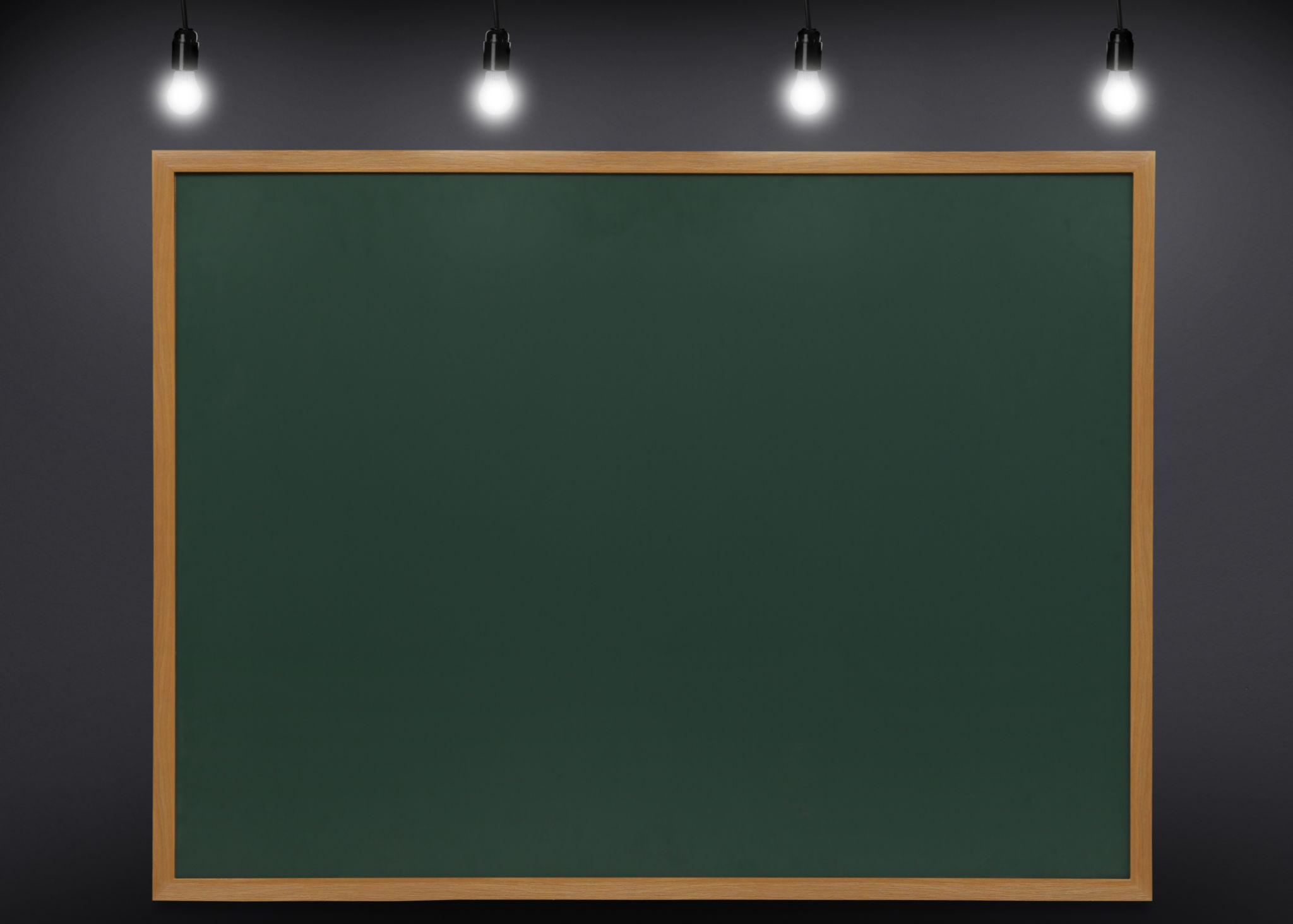 Front view of a surface-mounted blackboard light.