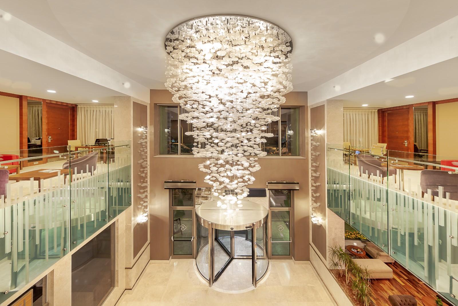Bespoke chandelier installed in a luxury hospitality project.
