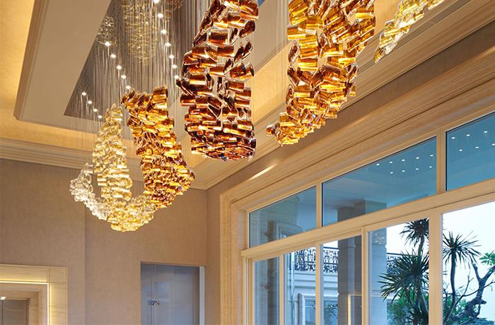 Bespoke chandelier installed in a luxury hospitality project.