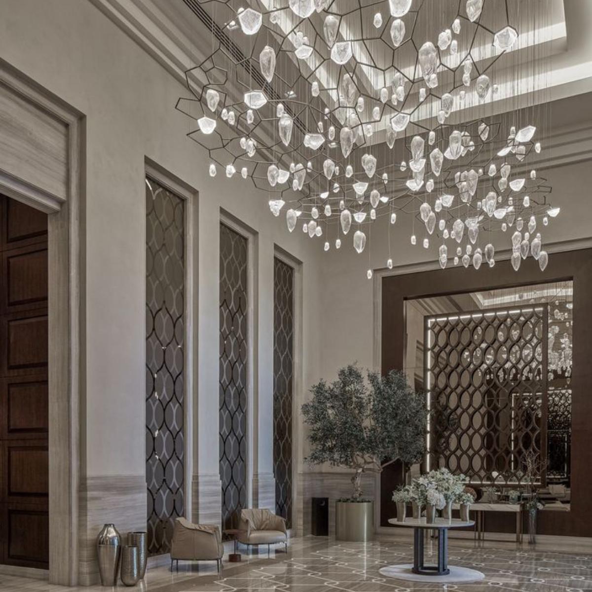 Bespoke chandelier installed in a luxury hospitality project.