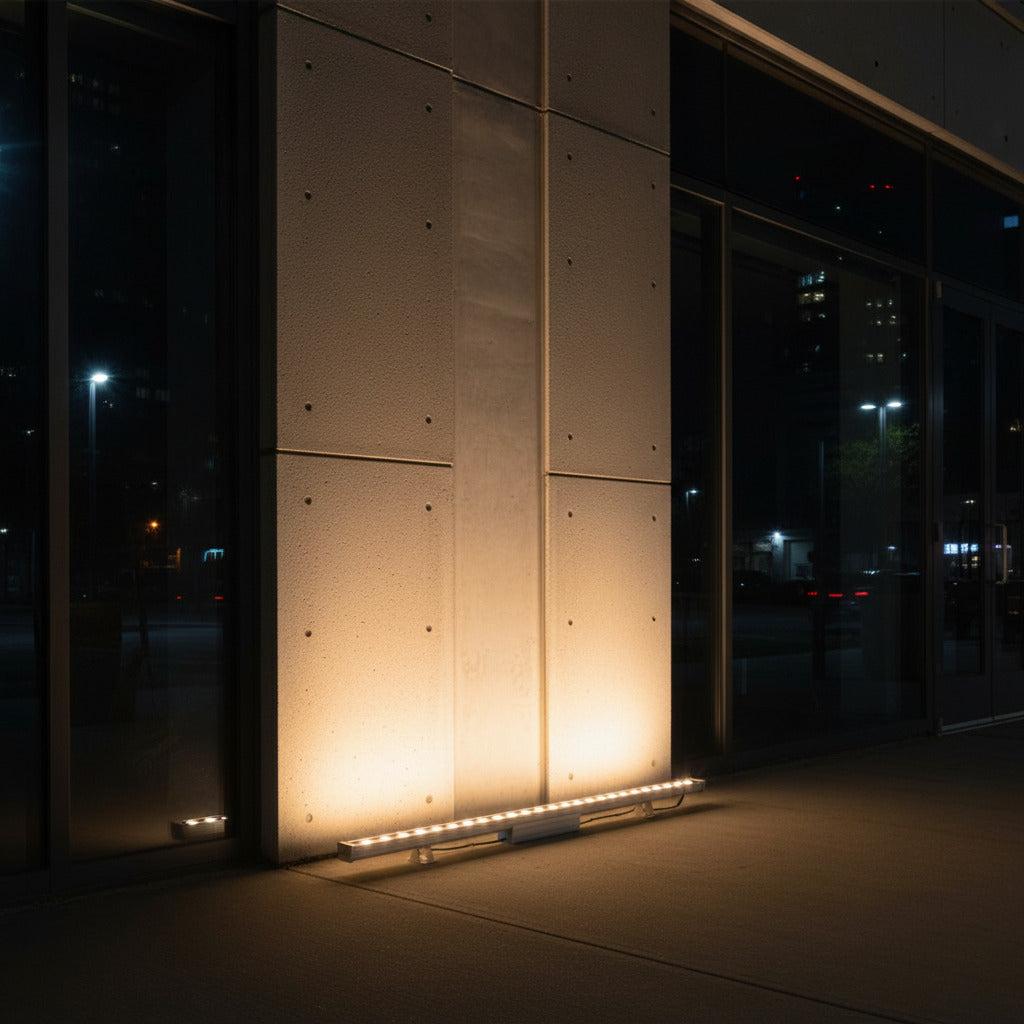 Grazer wall washers highlighting the texture of a contemporary architectural façade.