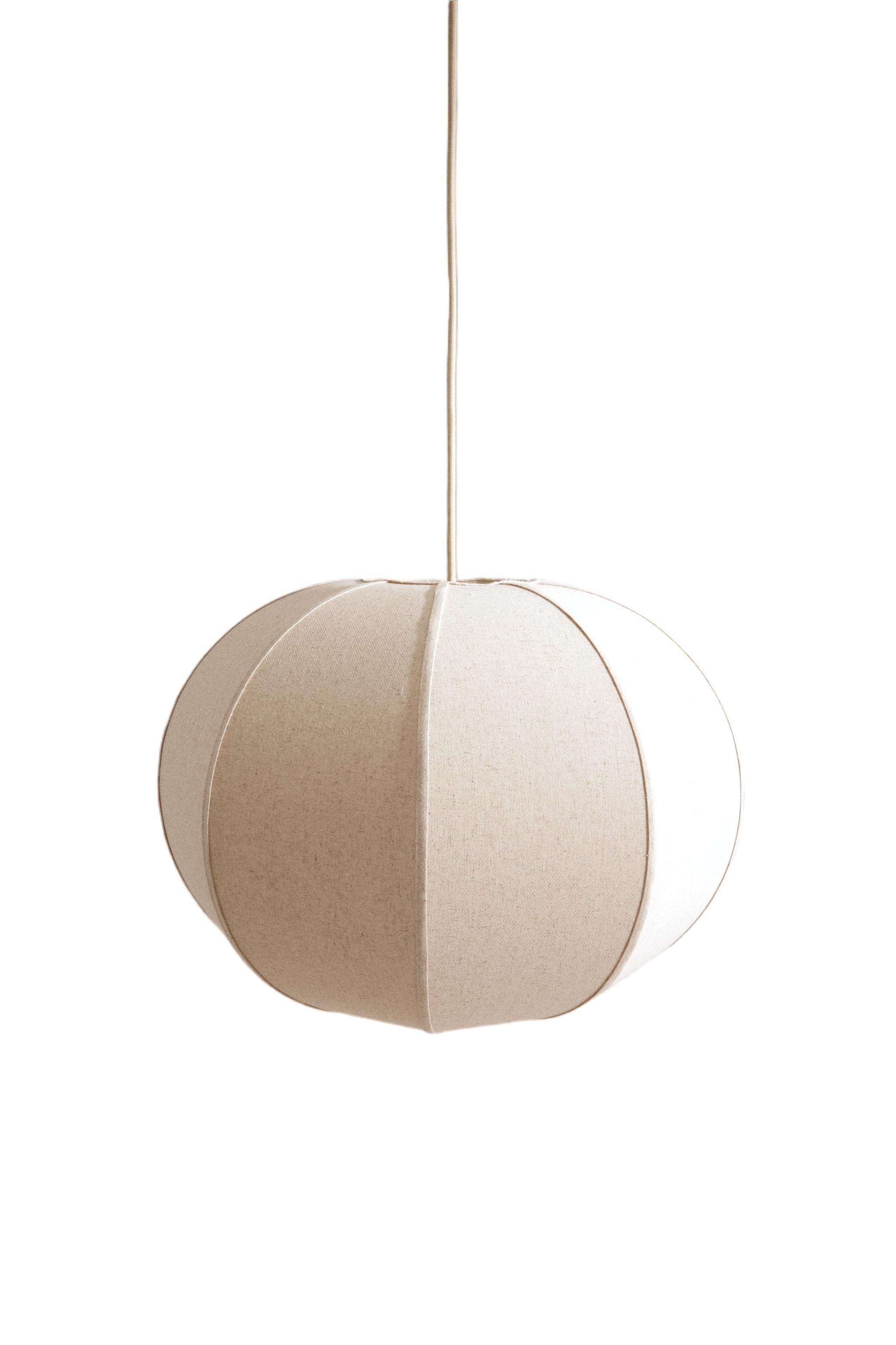 Front view of a decorative fabric pendant light for architectural interiors.