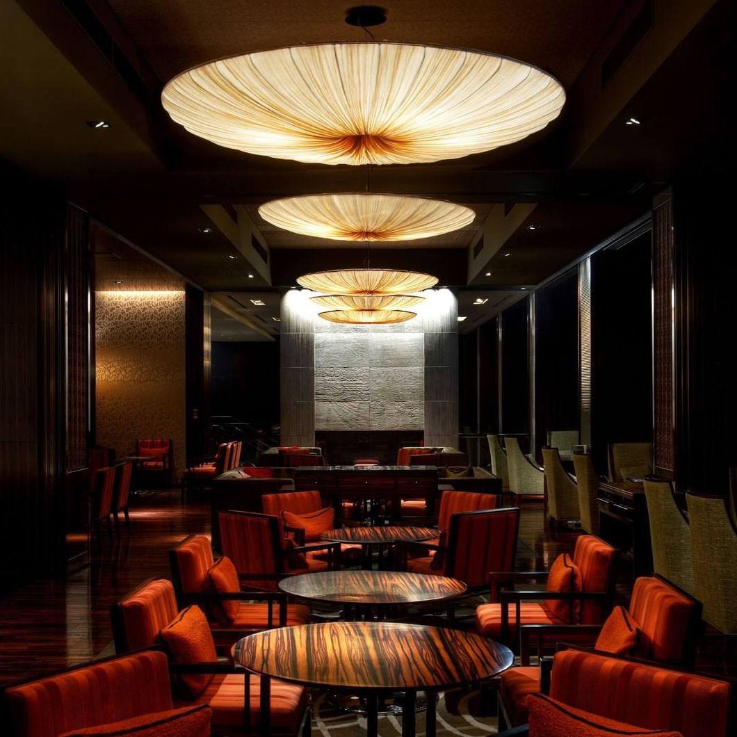 Fabric pendant lighting installed in a premium hospitality interior.