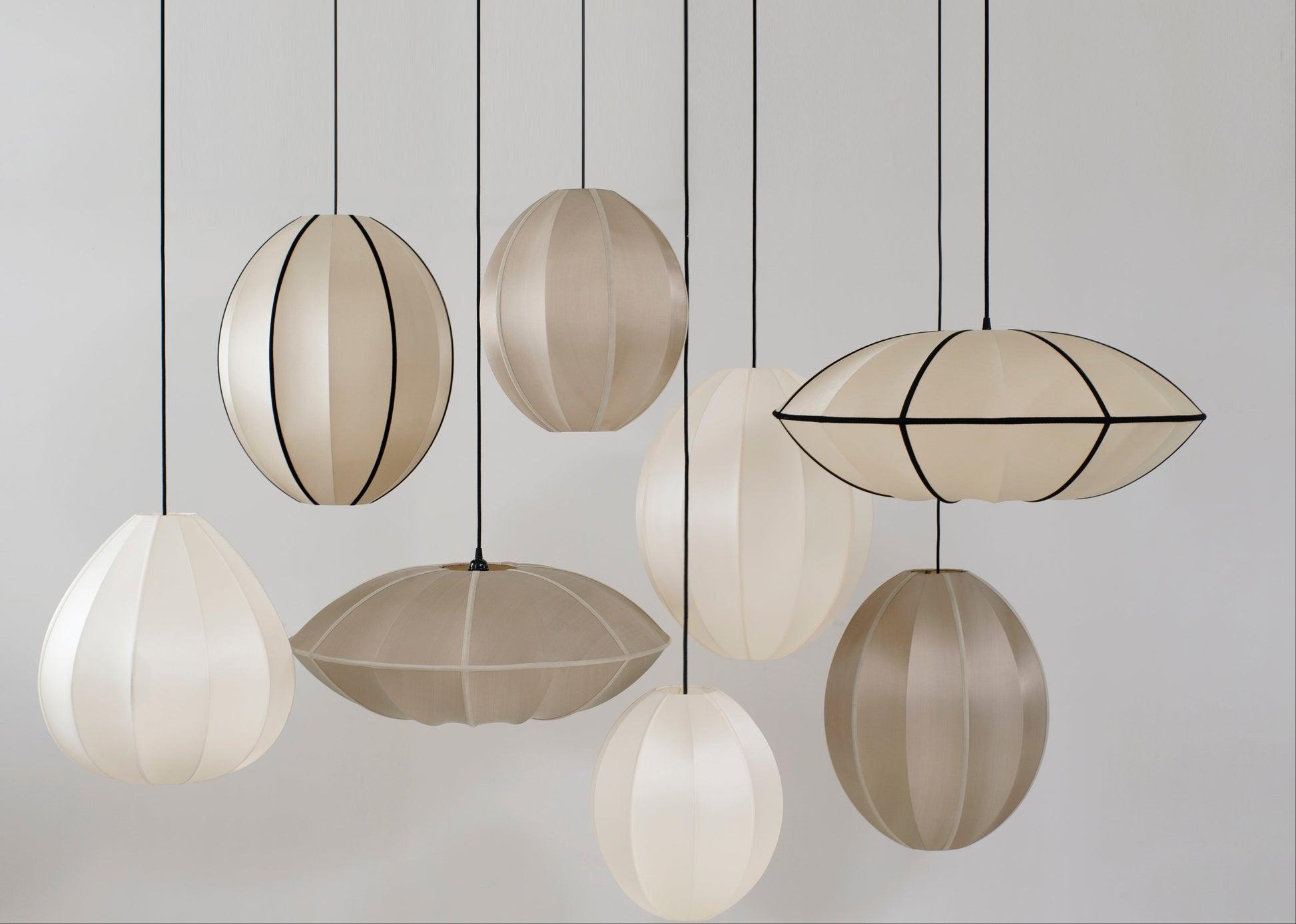 Fabric pendant lighting family featuring multiple sizes and design variations.