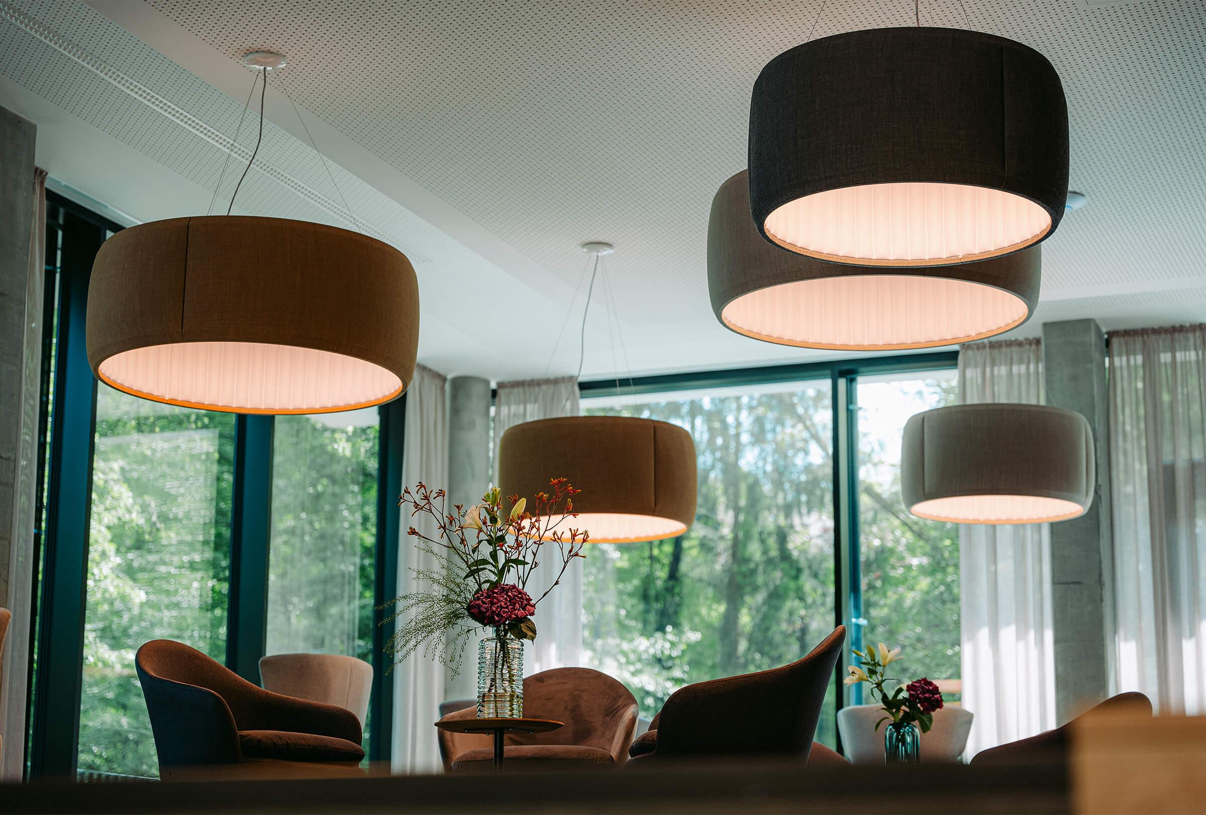 Fabric pendant lighting installed in a premium hospitality interior.