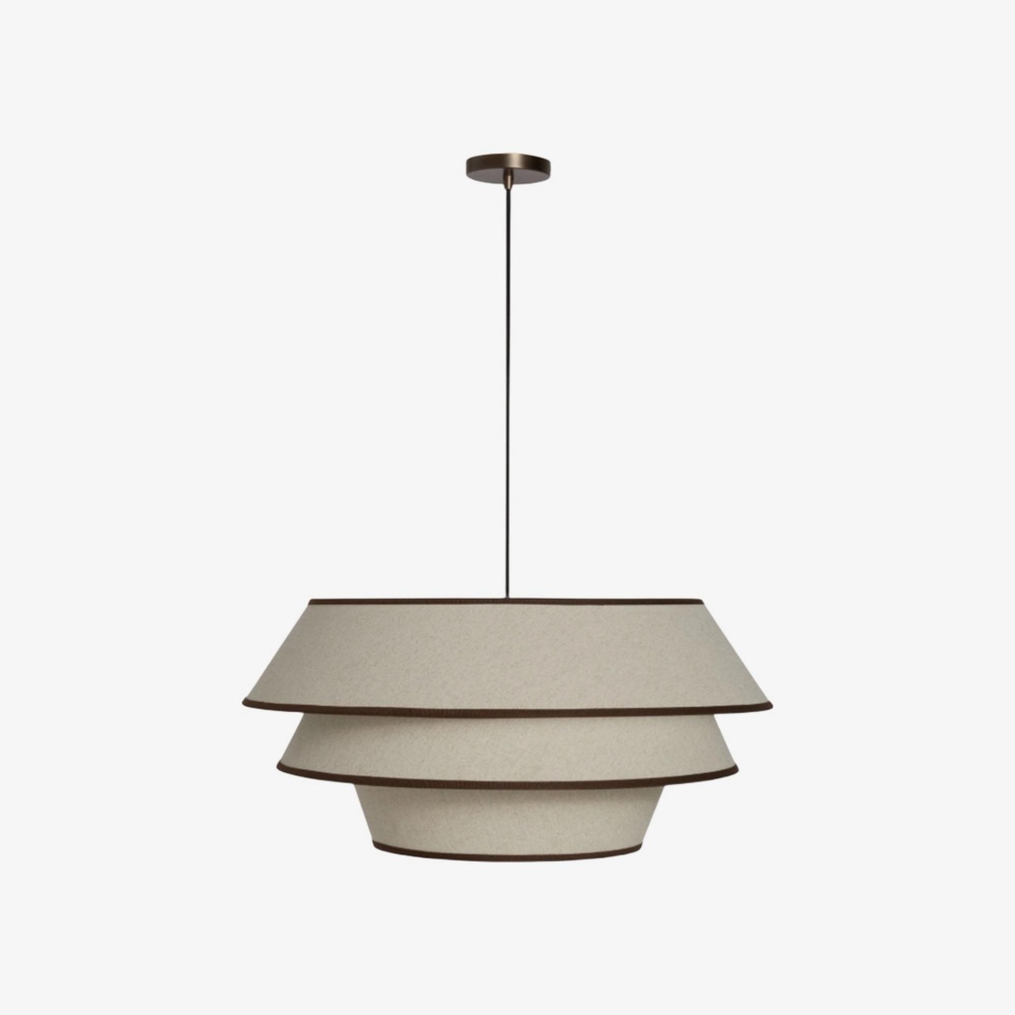 Front view of a decorative fabric pendant light for architectural interiors.