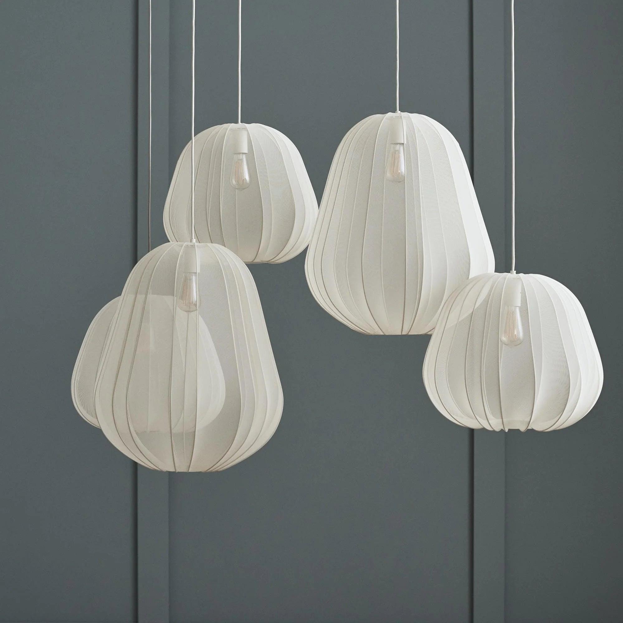 Fabric pendant lighting family featuring multiple sizes and design variations.