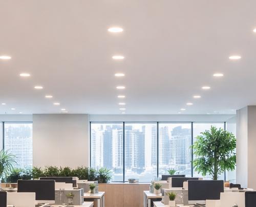 Modular recessed downlights installed in a contemporary office environment.