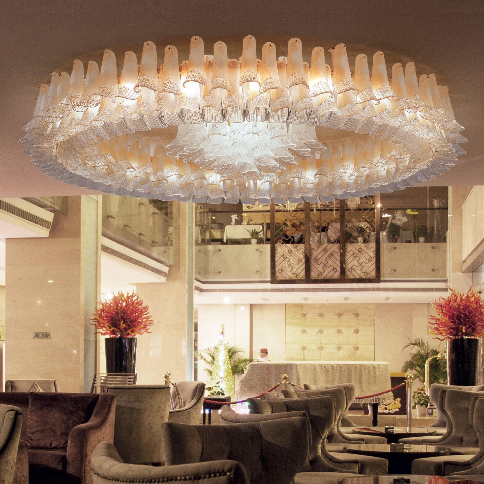 Murano glass ceiling lighting integrated into an elegant boutique hotel interior