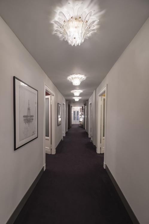 Murano glass ceiling lighting integrated into an elegant boutique hotel interior