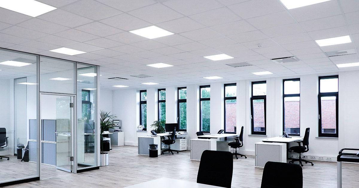 Recessed microprismatic panel lighting providing controlled illumination in a modern open-plan office