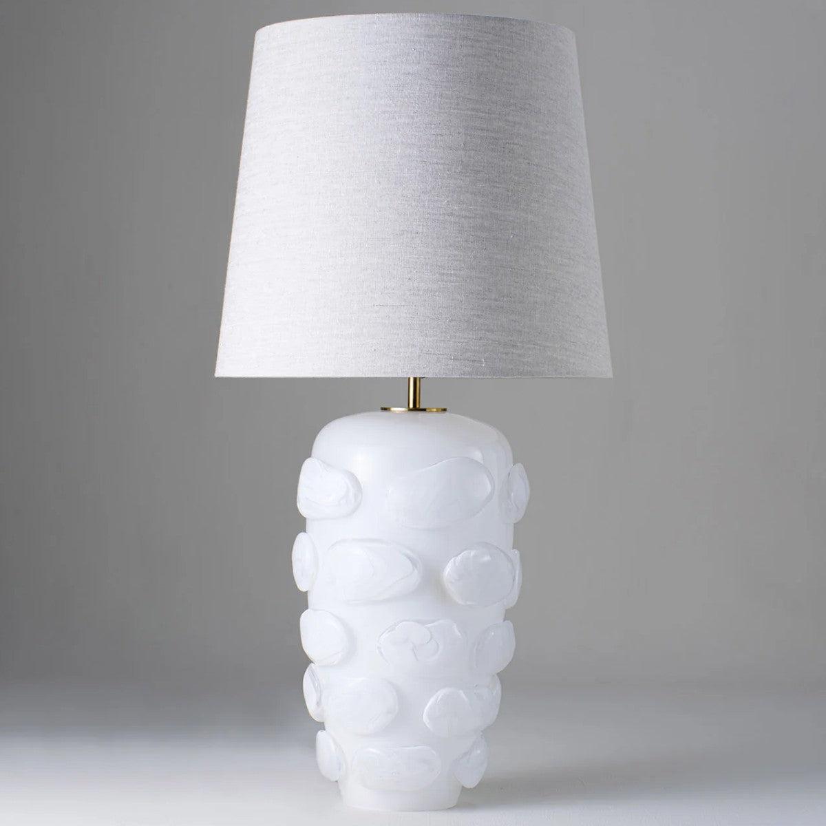 Front view of a luxury table lamp highlighting elegant proportions and sophisticated architectural detailing.