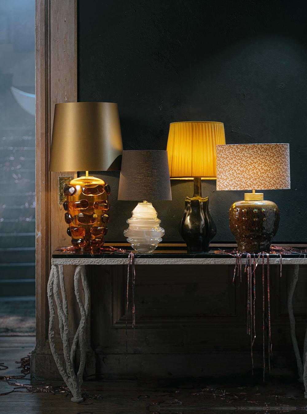 Collection of luxury table lamps featuring premium materials and exclusive decorative finishes for hospitality interiors.