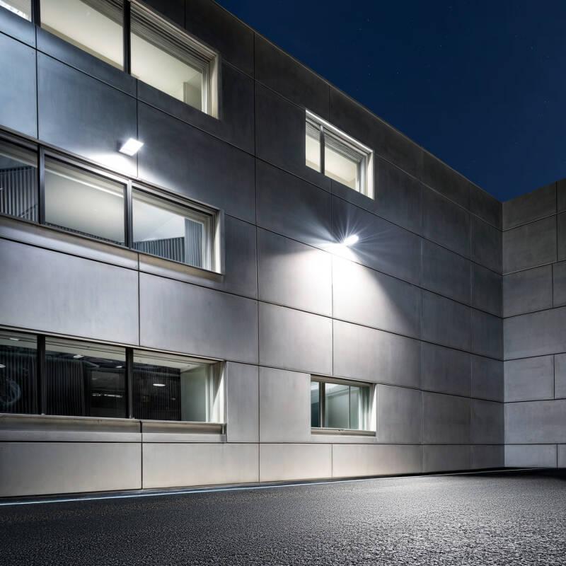 Architectural LED floodlights illuminating a contemporary building façade.