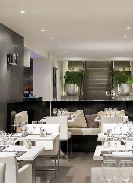 Twin adjustable recessed downlights installed in a hospitality ceiling application.