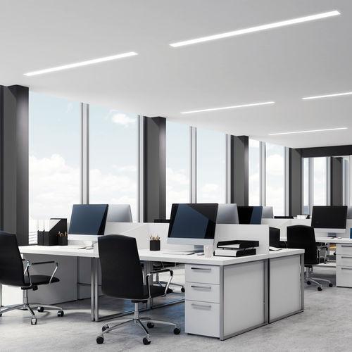 Slim recessed linear lights installed in a contemporary office environment.
