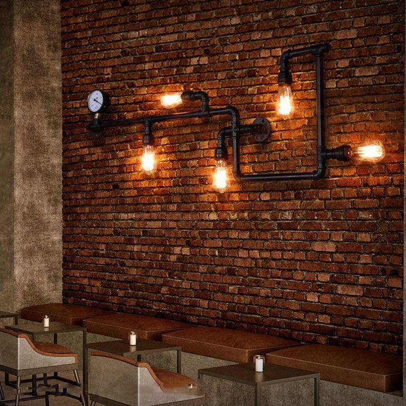 Industrial wall lamp installed in a contemporary restaurant with industrial architectural styling.