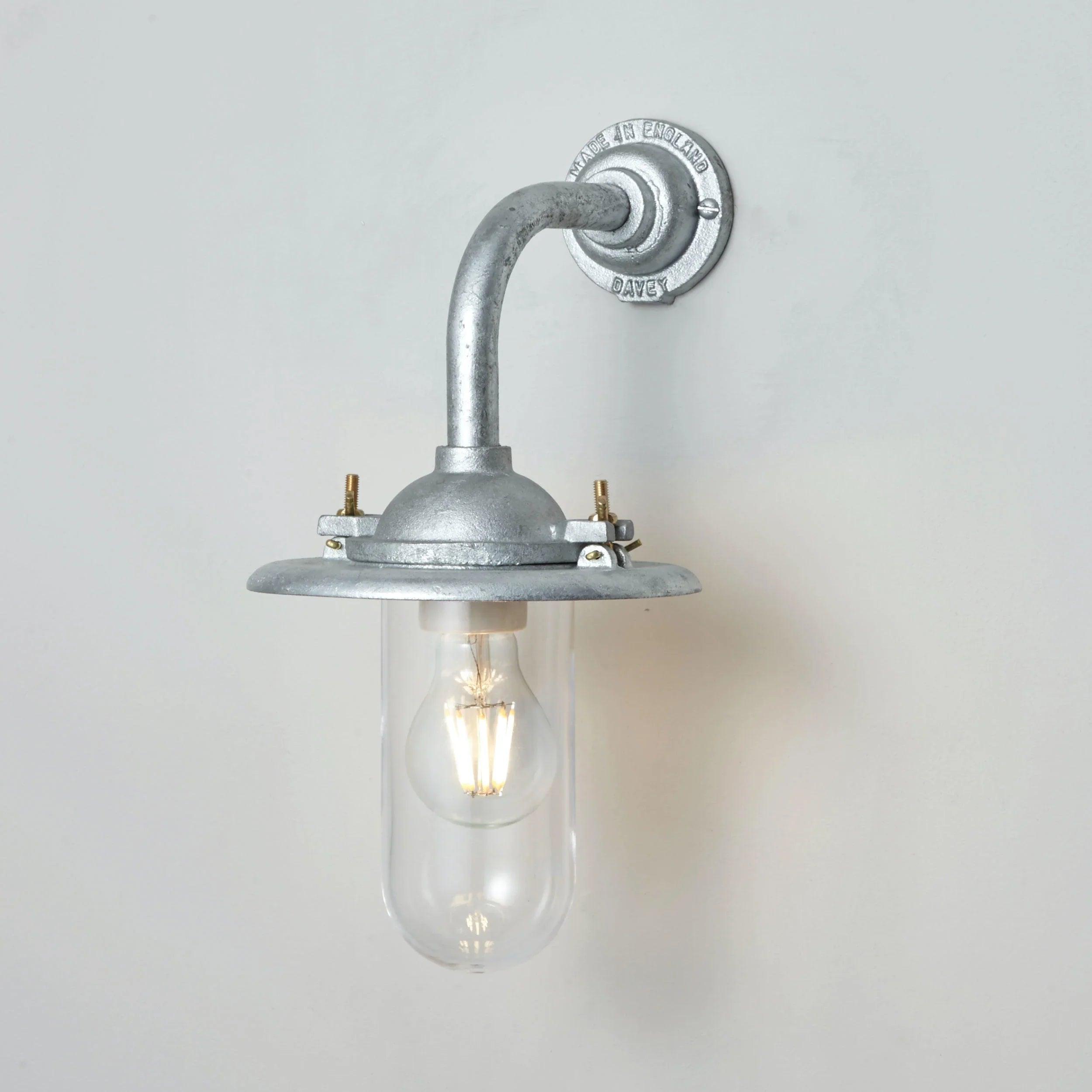 Front view of an industrial-style wall lamp with minimalist architectural detailing.