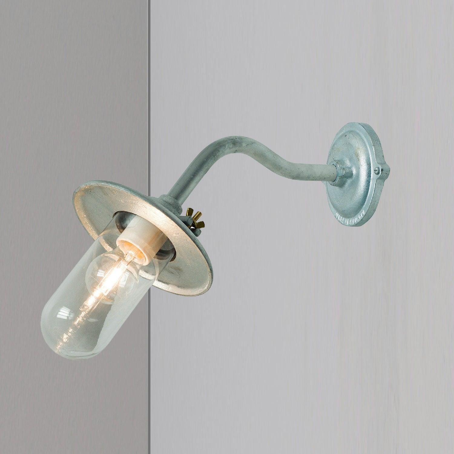 Front view of an industrial-style wall lamp with minimalist architectural detailing.