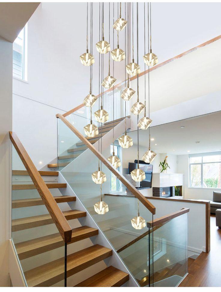Cluster pendant lighting installed in a luxury hospitality interior.