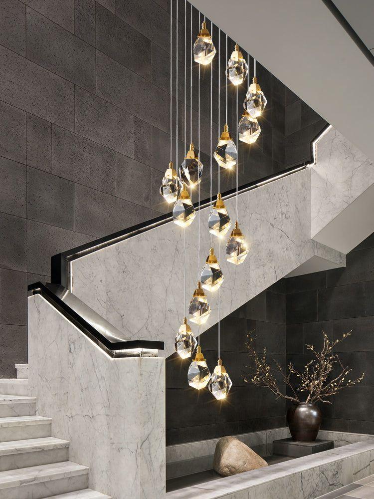 Cluster pendant lighting installed in a luxury hospitality interior.