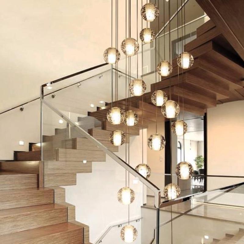 Cluster pendant lighting installed in a luxury hospitality interior.