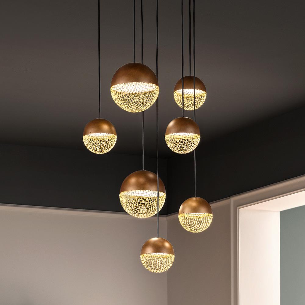 Cluster pendant lighting installed in a luxury hospitality interior.