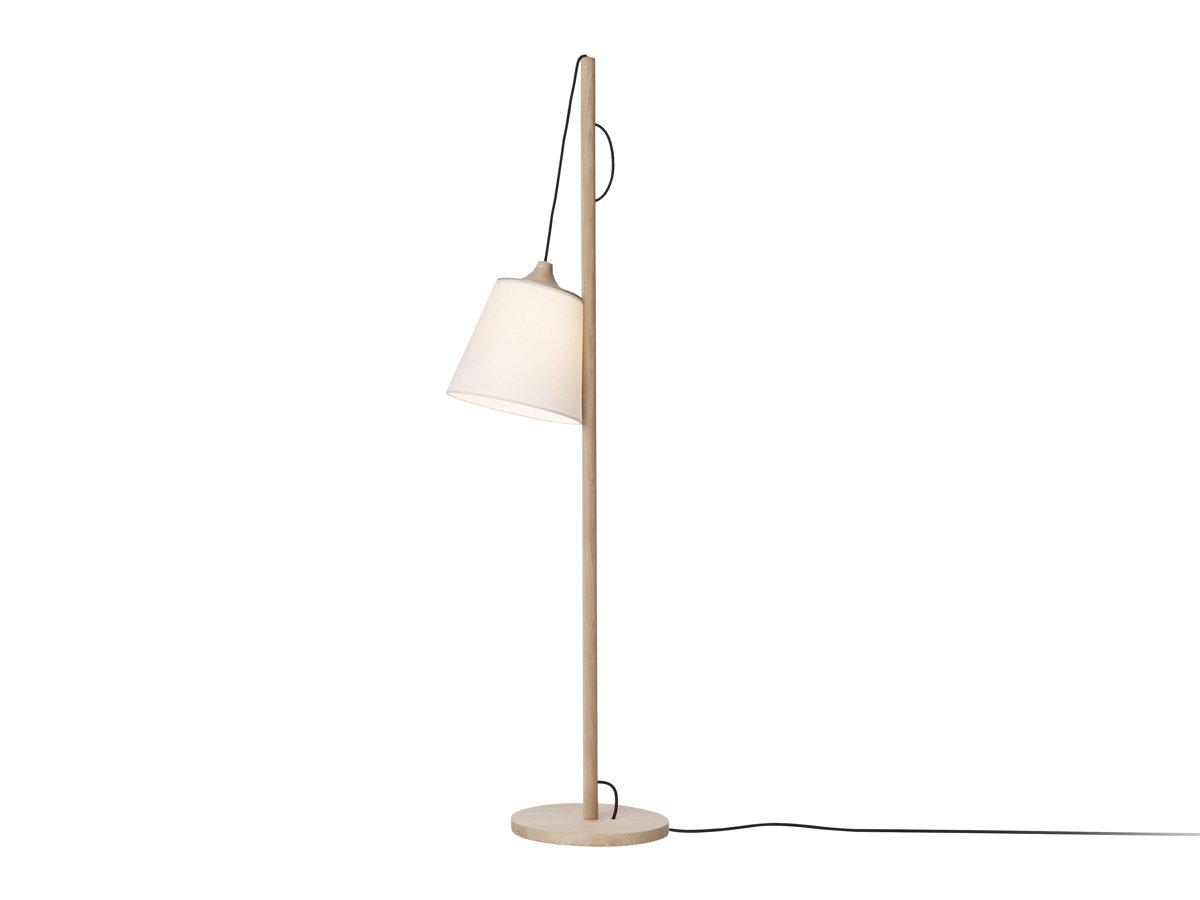 Scandinavian floor lamp photographed on a clean white background showcasing natural materials and minimalist Nordic design.