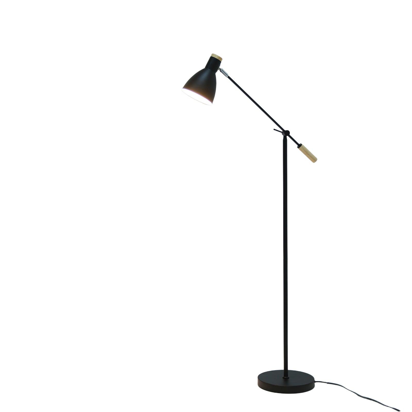 Scandinavian floor lamp photographed on a clean white background showcasing natural materials and minimalist Nordic design.