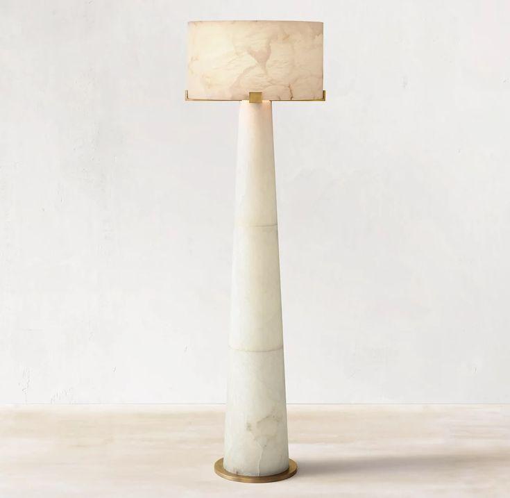 Front view of a marble floor lamp showcasing elegant proportions, luxurious natural stone and refined craftsmanship.