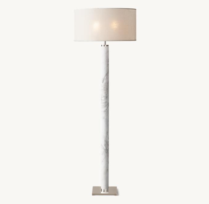 Marble floor lamp photographed on a clean white background highlighting its natural marble base and premium metal detailing.