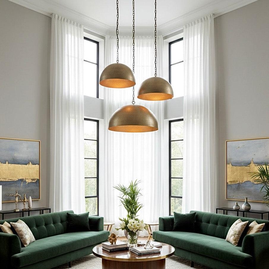 Brass pendant lighting installed in a luxury hospitality interior.